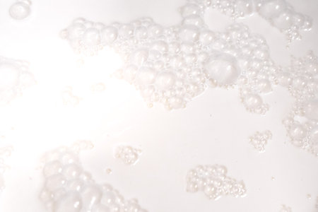 Background with milk texture, close-up milk bubbles. High quality photoの写真素材