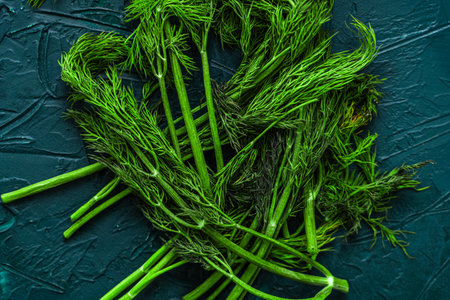 Wilted dill on a green or malachite background. High quality photo