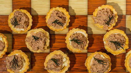 Tartlets with liver pate and a wooden chessboard. High quality photoの写真素材