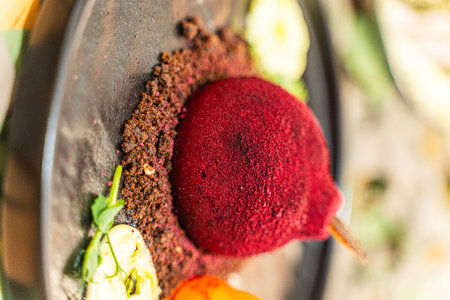 Beetroot salad in the original pear-shaped serving. Beetroot souffle on a dark plate with sauce and vegetables. High quality photoの写真素材