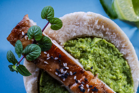Cod fillet with spinach and broccoli puree and cauliflower on a blue plate. The concept of healthy and dietary nutrition. Restaurant serving of the dish. Close-up. High quality photoの写真素材