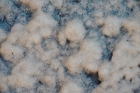 Background with white salt texture. Close-up of the surface of the salt lake. Use for a banner. High quality photoの写真素材