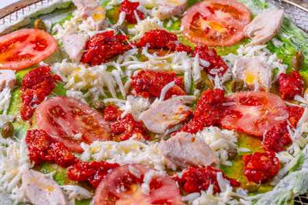 Pizza on green spinach dough with tomatoes and basil. The concept of healthy eating. Close-up. High quality photoの写真素材