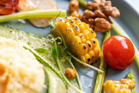 Close-up piece of fried corn with herbs and vegetables. High quality photo