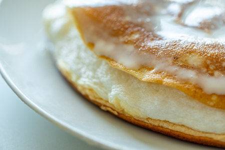 Slice of omelette poulard with pancakes on a light background. close-up High quality photo