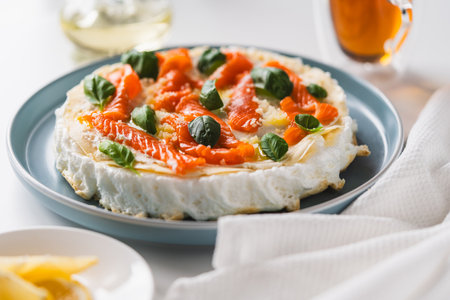 Omelette Poulard. Omelette of Mother Poulard. French omelette with whipped egg whites, lightly salted trout and basil. Beautiful, healthy and tasty breakfast. High quality photoの写真素材