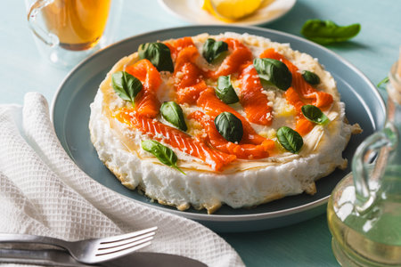Omelette Poulard. Omelette of Mother Poulard. French omelette with whipped egg whites, lightly salted trout and basil. Beautiful, healthy and tasty breakfast. High quality photoの写真素材