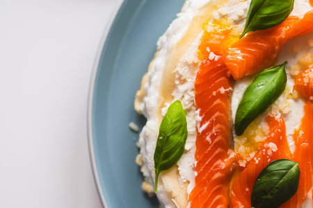 Omelette Poulard. Omelette of Mother Poulard. French omelette with whipped egg whites, lightly salted trout and basil. Beautiful, healthy and tasty breakfast. Top view. Close-up. Copyspace. High quality photoの写真素材