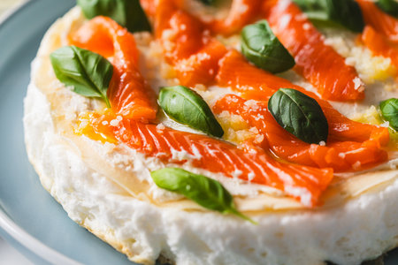 Omelette Poulard. Omelette of Mother Poulard. French omelette with whipped egg whites, lightly salted trout and basil. Beautiful, healthy and tasty breakfast. Top view. Close-up. Copyspace. High quality photoの写真素材
