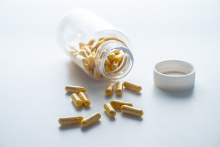 A jar with pills inside lies on a white background. Hyaluronic acid, collagen, vitamins or barberry...