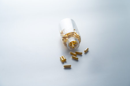 A jar with pills inside lies on a white background. Hyaluronic acid, collagen, vitamins or barberry...