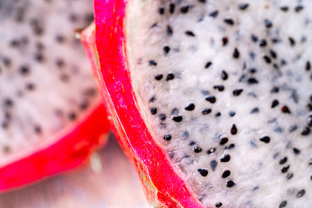 Dragon fruit or Pitahaya is a fruit cut in half on a wooden gray background. Close-up. High quality photo. Backgroundの写真素材