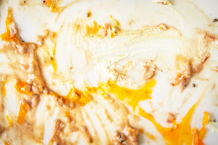Background, dirty white plate, food smeared on the plate. High quality photoの写真素材