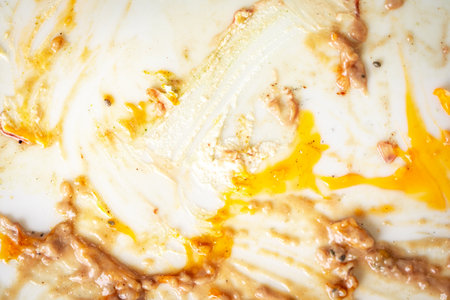 Background, dirty white plate, food smeared on the plate. High quality photoの写真素材