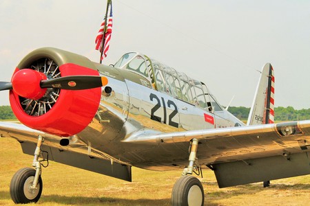A Vultee BT-13 Valiant, an American World War II-era basic trainer aircraft, sitting on an airfield 