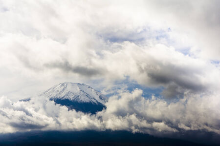 Fuji surrounded by cloudsの写真素材