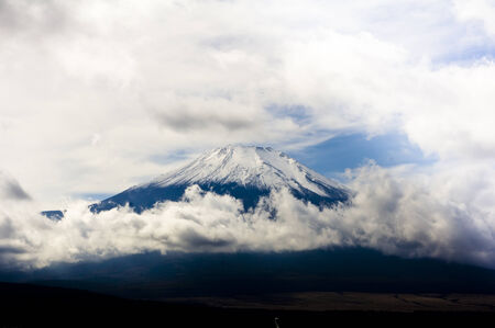 Fuji surrounded by cloudsの写真素材