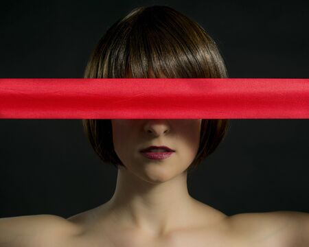 Woman with Red Ribbonの写真素材