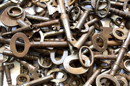 Vintage Antique Padlock Keys on White Backgroundの写真素材