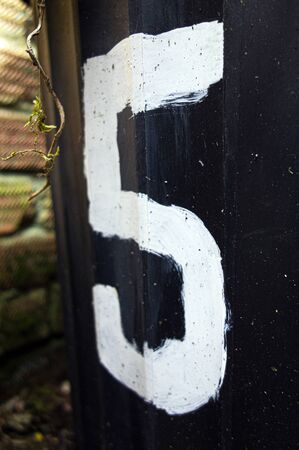 Written Wording in Distressed State Typography Found Number Five 5