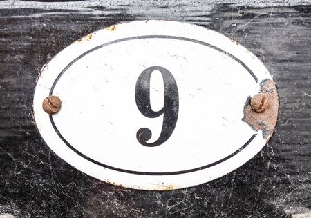 Written Wording in Distressed State Typography Found Number Nine 9
