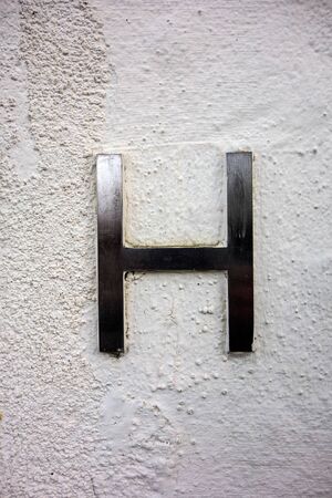 Written Wording in Distressed State Typography Found Letter hの写真素材