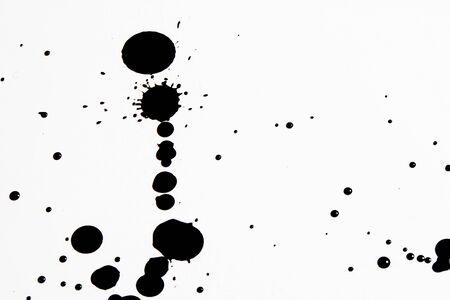Black Ink Paint Splatter Drip on White Backgroundの写真素材