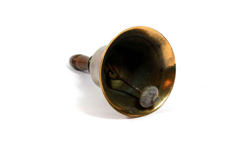 A Vintage Brass School Bell On White Background