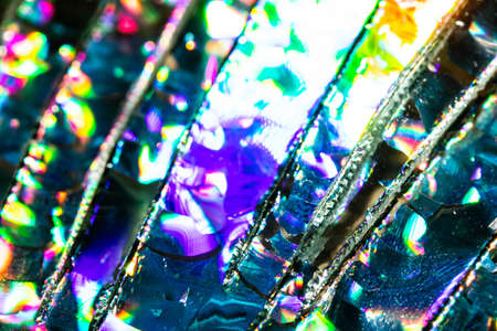 A Broken CD Cut Up To Make Abstract Holographic Backgroundの写真素材