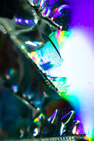 A Broken CD Cut Up To Make Abstract Holographic Backgroundの写真素材