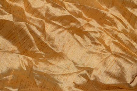 A Golden Copper Fabric Shiny Backgroundの写真素材