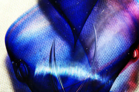 A Vibrant Abstract Glass Swirls and Bubbles from a Paperweight with Lines and Coloursの写真素材