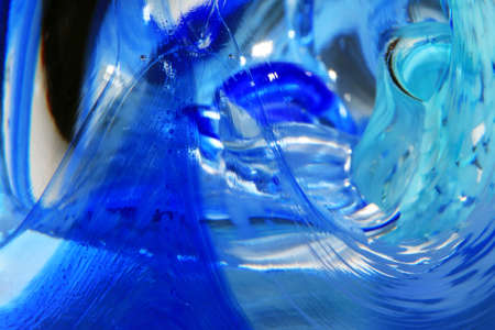 A Vibrant Abstract Glass Swirls and Bubbles from a Paperweight with Lines and Coloursの写真素材