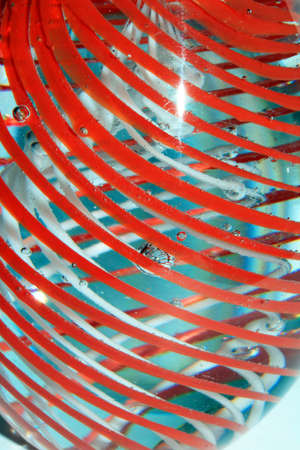 A Vibrant Abstract Glass Swirls and Bubbles from a Paperweight with Lines and Coloursの写真素材