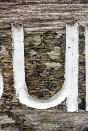 A Written Wording in Distressed State Typography Found Letter Uの写真素材