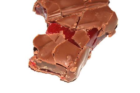 A Bitten Half Eaten Chocolate Bar with Cherry Jelly Inside on White Backgroundの写真素材