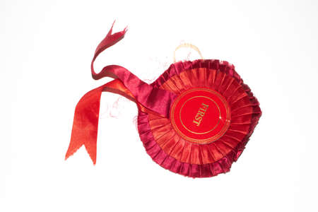 Vintage Winner Rosette Prize Badge for Best in Show or Winng a Race of Award on White Backgroundの写真素材