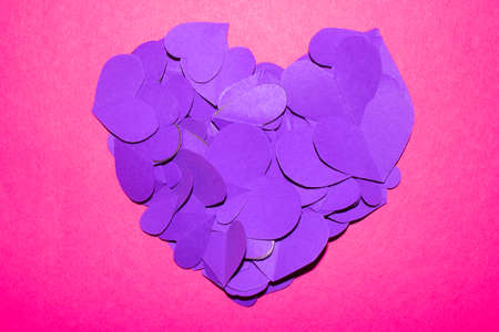 A Pink and Purple Paper Love Hearts Cut Out for Background for Valentines Day or Weddings