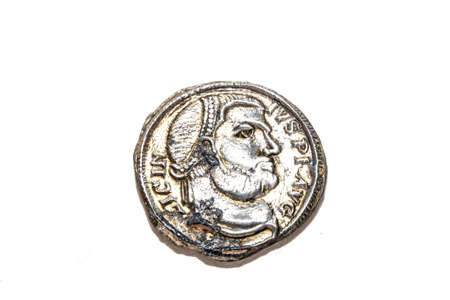 A Silver Old Roman Coin On White Backgroundの写真素材