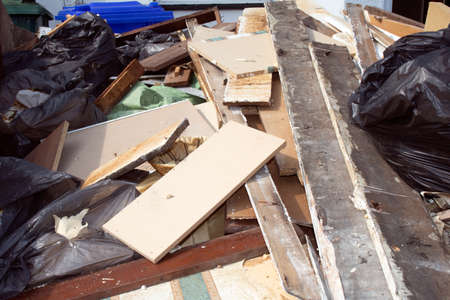 House renovating DIY housing repairs Broken Timber in a Skipの写真素材