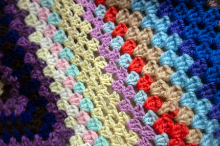 A Close Up of a Multicolour Crochet Knitted Blnket in Vintage Design