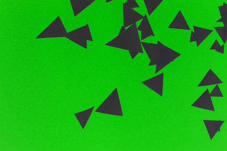 A Green and Black Geometric Paper Triangle Pieces for Background