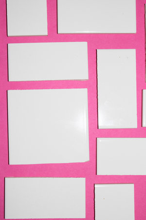 A White Abstract Shaped Tiles On a Coloured Background Close Up