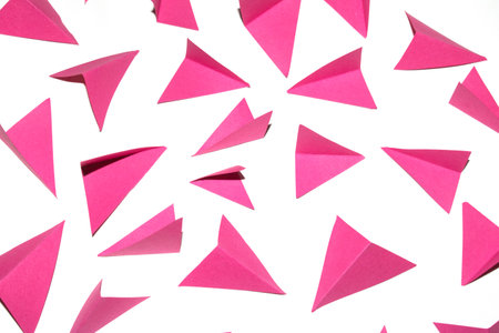 A Pink and White Geometric Folded Paper Triangle Shapes for Background Craft