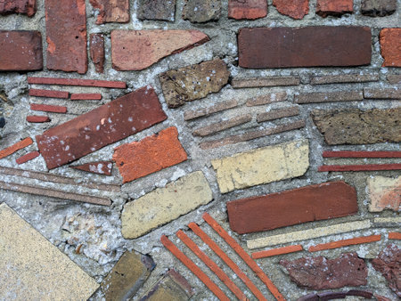 A Decorative Brick Wall Design with Lines and Swirls Clay Abstract Tiles