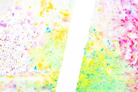 A Vibrant Watercolor Paint on a White Background with Splatters and Blending Colours in Pretty Rainbow for Backgroundの写真素材