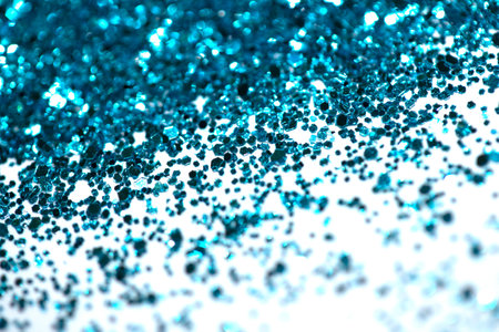 A Sparkling Glitter on White Background Bokeh Abstract Close Up Blue