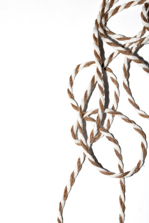 A Wrapping Paper Stripy String Rope Close Up on White Background