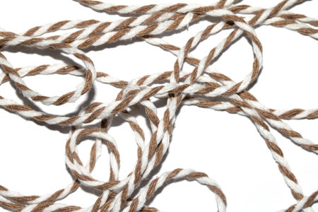 A Wrapping Paper Stripy String Rope Close Up on White Background
