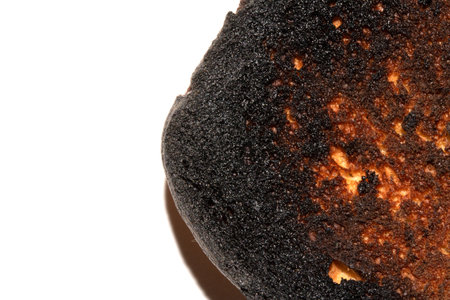 A Very Burnt Bread Roll Toast Close Up Texture